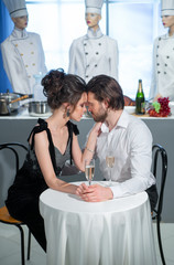Young couple in love on a date in a restaurant
