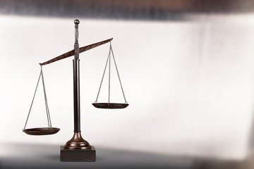 Law scales on table background. Symbol of justice