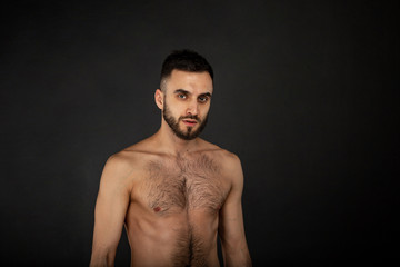 Fototapeta premium Portrait with copy space of attractive, virile, harsh, sporty man