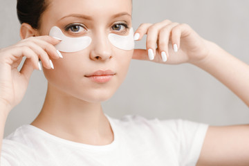 Beauty woman with patches. Mask under eyes treatment face
