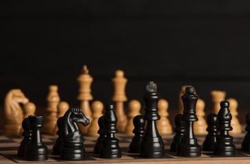 Chess board with chess pieces. Chess on the dark background. Business success concept. Strategy....