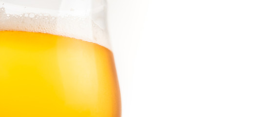 Glass of gold beer on white background