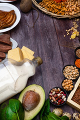 Products rich with zinc. Composition from natural organic products and the sign of zinc on a wooden background.