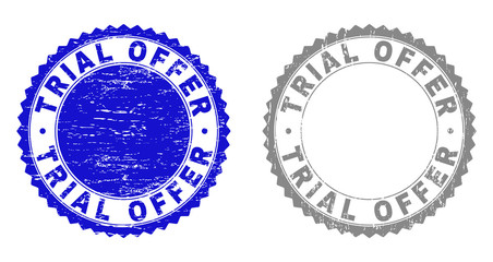 Grunge TRIAL OFFER stamp seals isolated on a white background. Rosette seals with grunge texture in blue and gray colors. Vector rubber stamp imitation of TRIAL OFFER text inside round rosette.