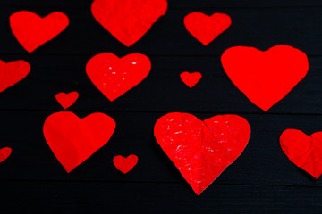 Valentines day greeting card. Handmaded hearts on wooden table. Love background 