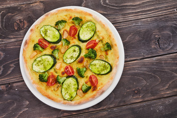 vegetarian pizza on the wooden background