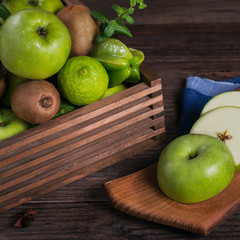Set of green fruits for healthy diet and detox: apple, lime, kiwi, mango, carambola and mint.