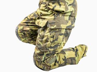 Outdoor trousers for outdoor activities. Camouflage pants on a white background,