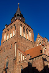 Fototapeta na wymiar Big church tower in front of blue sky in germany