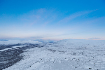 Lake Kilpisj&auml;rvi, Finnland at sunrise in winter wonderland, view from Mountain Saana
