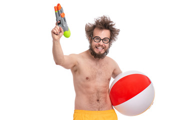 Crazy bearded Man with funny Haircut in eye Glasses, ready for fun at sunny beach. Happy and silly...
