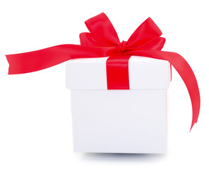White gift box with red ribbon.