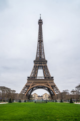 Fototapeta na wymiar View at Eiffel Tower from the Champ de Mars (Field of Mars)
