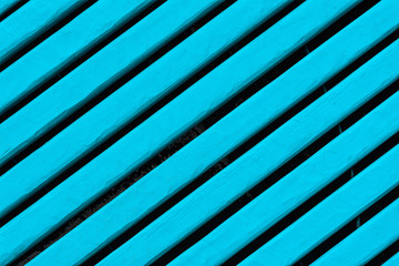 Obraz premium Background of blue painted wooden fence with parallel lines, diagonal design