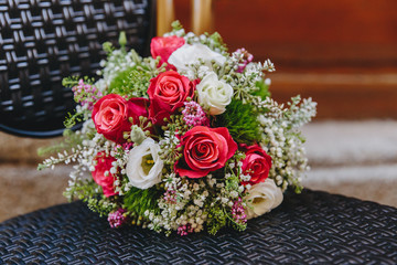 Bridal bouquet with pink roses and white flowers