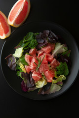 Healthy salad grapefruit and green leaves. Deliciouse dietary food. lose weigh.