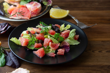 Salad with grapefruit, lose weigh food. Diet plan. Wooden rustic table.