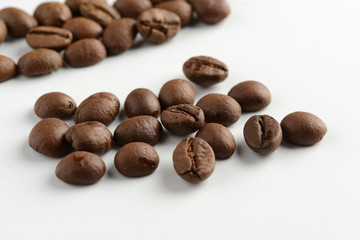 coffee grains on a white background, close-up, coffee roasting