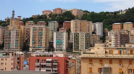 Genova, Italy - 01/24/2019: An amazing caption of the city of Genova from the hills in winter days, with a great grey sky, some natural river and beautiful buildings 