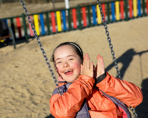 Portrait of beautiful girl on the playground