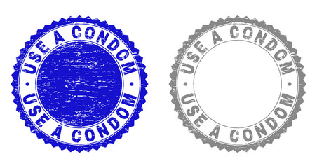 Grunge USE A CONDOM stamp seals isolated on a white background. Rosette seals with grunge texture in blue and grey colors. Vector rubber stamp imprint of USE A CONDOM caption inside round rosette.