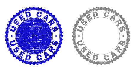 Grunge USED CARS stamps isolated on a white background. Rosette seals with grunge texture in blue and grey colors. Vector rubber stamp imitation of USED CARS tag inside round rosette.