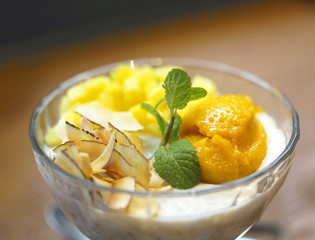 Coconut dessert with mango and chips very tasty