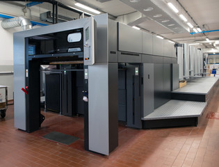 Press printing - Offset machine. Printing technique where the inked image is transferred from a plate to a rubber blanket, then to the printing surface.