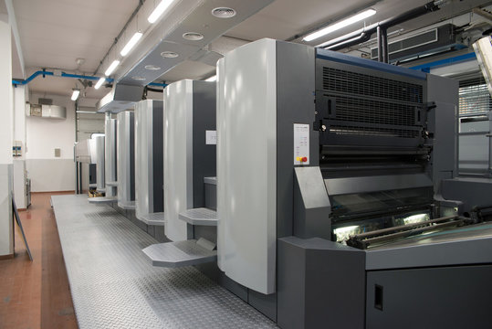 Press printing - Offset machine. Printing technique where the inked image is transferred from a plate to a rubber blanket, then to the printing surface.