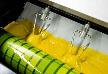 Press printing - Offset machine. Printing technique where the inked image is transferred from a...