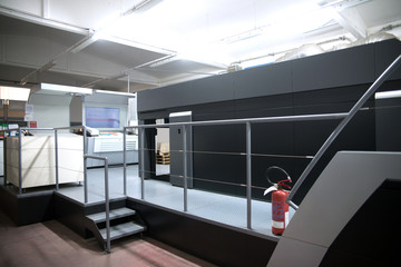 Press printing - Offset machine. Printing technique where the inked image is transferred from a...