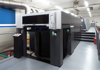Press printing - Offset machine. Printing technique where the inked image is transferred from a...