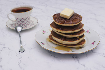 Pancake folded stack of with liquid honey on wooden background.selective focus.