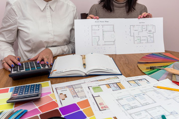 Designers teamwork in office showing house plan