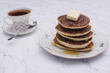 Pancake folded stack of with liquid honey on wooden background.selective focus.