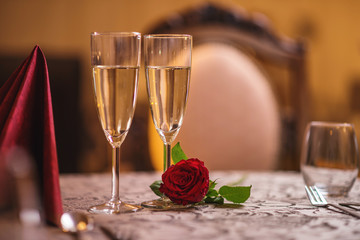 valentines day background with roses and champagne in hotel or restaurant, romantic evening 