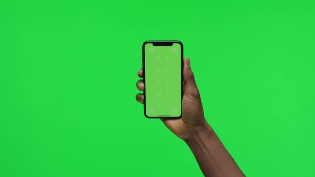Female Hand holding Green Screen Smartphone holding still