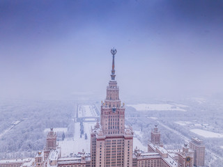 Fototapeta na wymiar Aerial view of the Moscow historical high-rise building in winter cloudy weather.