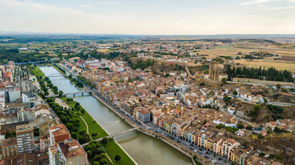 Aerial view of Balaguer with the river Segre, La Noguera, (Province of Lleida, Catalonia, Spain) - obrazy, fototapety, plakaty