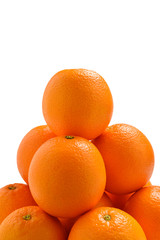 Pyramid of Oranges isolated on white background.