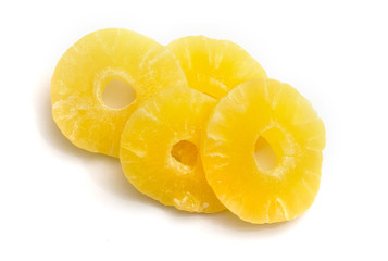 Slices of dried pineapple on a white isolated background_