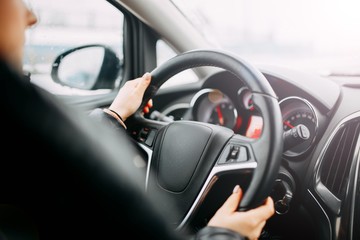 girl driving a car. modern interior.