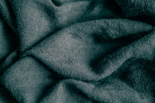 Macro photo of fabric gray. Knitting, wool. Texture of fabric with folds for designers. Blank for banner atelier, mester