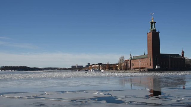 An early sunny spring day, meltwater under bridges at the Town City Hall in Stockholm
