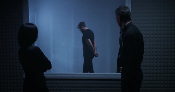 Woman identifying criminal in line-up