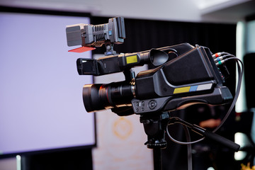 Camera recording publicity event . Press conference. Filming an event with a video...