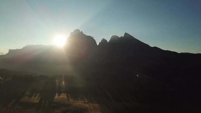 Aerial misty sunrise scenery at Alpe di Siusi, Dolomite Alps, Italy.