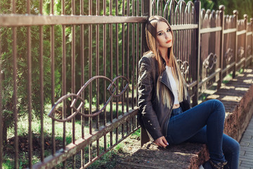 Street portrait of stylish happy young gorgeous pretty girl walking along the streets. Leisure, beauty, spring, freedom concept