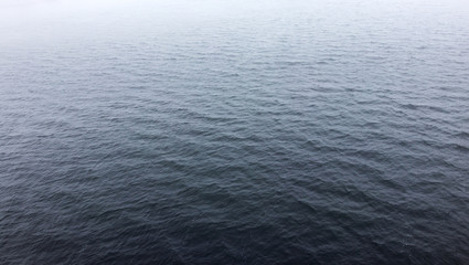 water surface in the fog. small ripples on the water. background