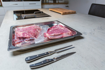 Elevatet view of beef in vacuum plastic bag for sous vide cooking